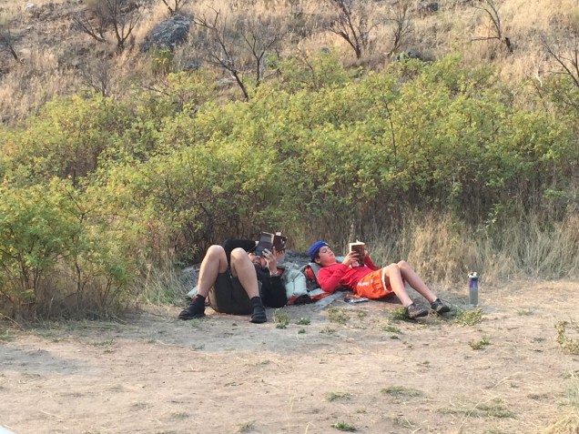 With a rock as a back rest and a personal flotation device (PFD) as a pillow, this was a pretty comfy spot for reading. And the fact that one of the kids on the trip voluntarily decided to join me was enough to melt the heart of any book lover. He even talked about our reading club.