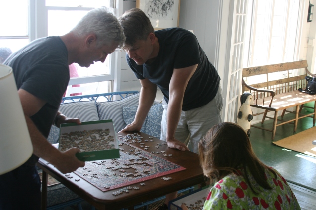 Puzzling with John's brother and his fiancee.